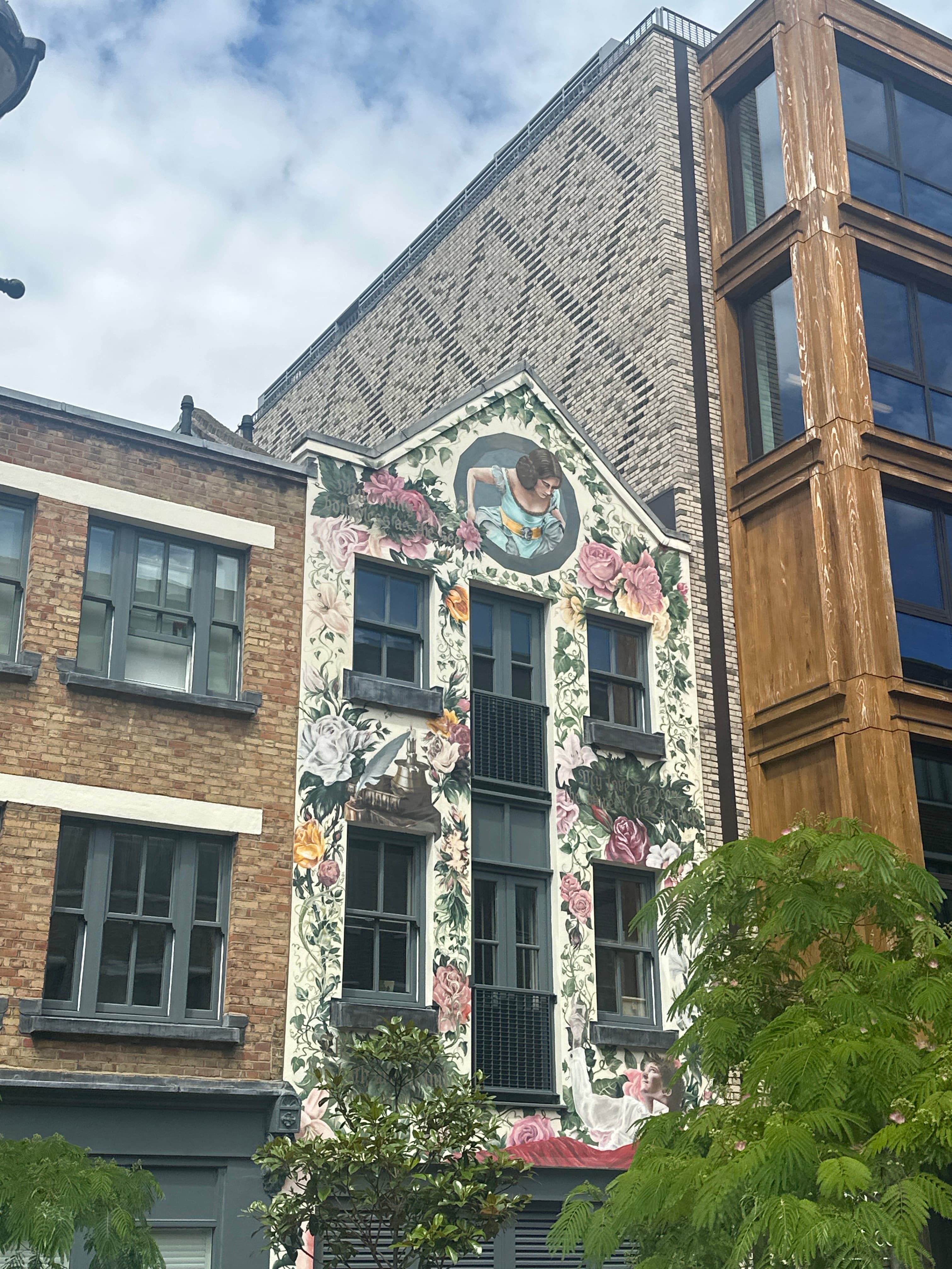 Look for the statue of a man on bench